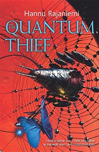 Cover of a paperback edition of The Quantum Thief by Hannu Rajaniemi, showing an abstract fractal cityscape in blue and gold